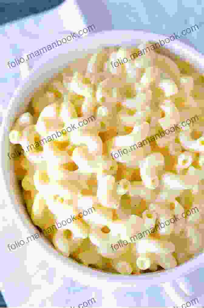 A Bowl Of Mac And Cheese With A Creamy Cheese Sauce. The American Plate: A Culinary History In 100 Bites